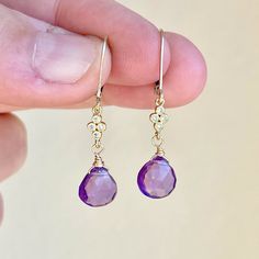 Amethyst Earrings, February Birthstone, Purple Teardrop Dangle Earrings, Minimalist Earrings Gold or Silver, Dainty Amethyst Jewelry Gift  These precious delicate earrings feature Brazilian Amethyst heart shape teardrops adorned with a white topaz connector in either gold filled or sterling silver. The purple drop earrings are suspended from lever back ear wires in the finish of your choice. These earrings are very feminine and subtle, perfect for every day. These make a perfect daily earring, o Purple Drop Earrings, Minimalist Earrings Gold, Amethyst Heart, Teardrop Dangle Earrings, Amethyst Jewelry, February Birthstone, Earrings Minimalist, Amethyst Earrings, Delicate Earrings