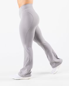 HIGHLIGHTS. Sculpting seamlines Buttery soft hand feel High Stretch Flared leg Sizes XXS - M: 31" inseam Sizes L - XXL: 32.5" inseam FIT SUGGESTION. This item runs true to Alphalete's standard sizing.. We recommend sizing up for a more relaxed fit or down for a more compressive fit.. Model is 5’2”/157.5cm, wearing a size. S. with 39"/99cm hips and 28”/71.1cm waist. MATERIALS AND WASHING DIRECTIONS. 75%. Nylon,. 25%. Spandex. We recommend washing inside-out on a cold setting. Hang to dry DESCRIPT Sporty Flare Pants For Loungewear, Sporty Flare Lounge Pants, Athleisure Flare Pants For Loungewear, Solid Color Fitted Activewear With Wide Legs, Fitted Wide Leg Solid Color Activewear, Solid Color Wide Leg Fitted Activewear, Solid Color Fitted Wide Leg Activewear, Gray Elastane Bottoms, High Stretch Straight Leg Bottoms For Pilates