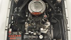 the engine compartment of a car is shown