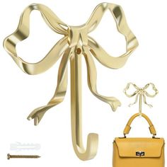 a yellow handbag with a bow on the front, and an earring attached to it