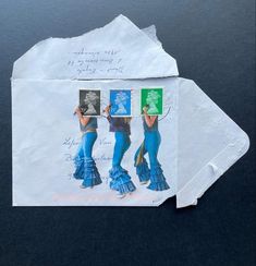 a piece of paper that has been altered to look like two women in blue dresses