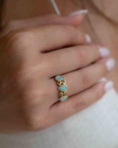 D E T A I L S — METAL: Gold Plated 18k: Gold plated jewelry has a layer of gold covering a base metal. — S T O N E S: Amazonite & Labradorite. BACK SIDE OF THE RING: The metal band of our rings is never completely covering the gem from the back side, so that the energy emanating from the stone will be able to flow freely toward our body and it should be quite sufficient to get the full benefit a given stone can bestow upon us. — •✧•✧•✧•✧•✧•✧•✧•✧•✧•✧•✧•✧•✧•✧•✧•✧— »» $ BU Y • M O R E • S A V E • M Adjustable Gold Turquoise Gemstone Ring, Gold Labradorite Gemstone Rings, Unique Gold Labradorite Rings, Adjustable Labradorite Open Ring, Blue Larimar Cabochon Rings, Organic Rings, Aqua Chalcedony, Labradorite Ring, Gold Plated Rings