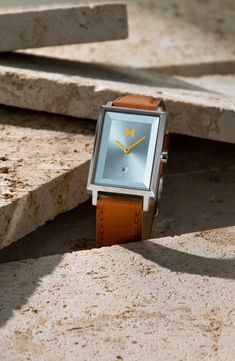 Modern minimalism makes this polished rectangular watch a distinguished accessory for any occasion. 24mm case Buckle closure Quartz movement Date window Mineral crystal face Stainless steel/leather Imported Rectangular Watch, Modern Minimalism, Minerals Crystals, Quartz Movement, Blue Brown, Bracelet Watch, Nordstrom, Buckle, Stainless Steel