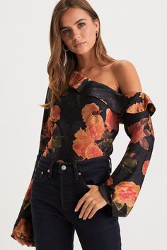 A naturally elegant babe like you was made for the Lulus Born Chic Black Floral Print Satin Off-the-Shoulder Top! Sleek woven satin, with a dreamy floral print, shapes an off-the-shoulder neckline with a chic fold-over detail, framed by long sleeves with flared cuffs. The blousy, darted bodice falls to a slightly asymmetrical hem. Hidden side zipper/clasp. Fit: This garment fits true to size. Length: Size medium measures 19.5" from shoulder to hem. Bust: Great for any cup size. Waist: Loosely Fi Off-shoulder Floral Print Party Blouse, Spring Satin Tops With Floral Print, Spring Satin Floral Print Tops, Spring Floral Print Satin Top, Spring Satin Off-shoulder Blouse, Off-shoulder Floral Print Party Tops, Elegant Off-shoulder Floral Print Tops, Off-shoulder Floral Print Tops For Fall, Fall Floral Print Off-shoulder Tops