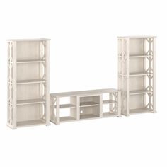 three white bookcases and a table on a white background