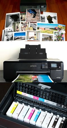 a printer sitting on top of a table next to some pictures and papers in front of it