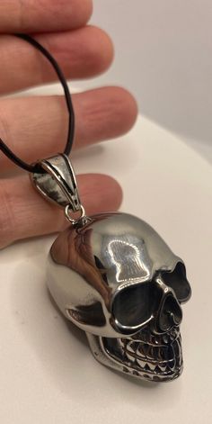 Black Skull-shaped Stainless Steel Necklace, Black Stainless Steel Skull Necklace, Gothic Skull Jewelry For Biker Events, Nickel Free Black Skull Necklace, Black Nickel Free Skull Necklace, Black Nickel-free Skull Necklace, Black Skull-shaped Engraved Jewelry, Black Skull Engraved Jewelry, Black Skull Shaped Engraved Jewelry