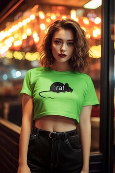 Channel your inner pop icon with the "(b)rat" Charli XCX inspired Crop Top. Crafted from 100% silky soft polyester, it's lightweight, breathable, and ideal for everyday wear. Whether you're heading to a festival, hanging out with friends, or just want to add some fun to your wardrobe, this crop tee is your go-to choice. Embrace your inner (b)rat with this must-have piece! Product Details - 100% polyester - Light fabric (6 oz/yd² (203 g/m - Sewn-in care label - Assembled in the USA from globally Green Summer Concert Top, Green Summer Top For Concerts, Green Summer Concert Tops, Green Hip Hop Top For Summer, Green Hip Hop Tops For Summer, Summer Band Merch Cropped T-shirt With Crew Neck, Punk Short Sleeve Crop Top With Letter Print, Y2k Style Green Crop Top For Streetwear, Summer Band Merch Cropped T-shirt For Streetwear