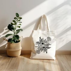 This 100% cotton bag comes in one size - 15" x 16"- perfect for everyday wear. While the canvas material will show off your designs in great colors, it's durable and will last for years. The bag features 20" handles (made from the same canvas), making it easy to carry even with a week's worth of shopping. .: 100% cotton canvas .: Available in natural and black colors .: Heavy fabric (12 oz/yd² (406.9 g/m .: Sewn-in label Botanical Style Canvas Bags For Everyday Use, Botanical Style Cotton Bags As Gift, Botanical Cotton Canvas Bag For Everyday Use, Eco-friendly Cotton Canvas Bag Gift, Botanical Cotton Bags As A Gift, Botanical Cotton Bags As Gift, Botanical Canvas Bags For Everyday Use, Organic Cotton Canvas Bag For Gift, Organic Cotton Bags Gift