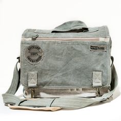 This Messenger Bag is  made of original truck and military canvas. - heavy duty cotton - all weather resistant - unique in detailing and shade of canvas - light and durable    Features   - 1 large zippered interior compartment - cotton lining with key/phone zip pocket - small outer pockets for phone, pencils etc. - 1 big zippered outer pocket - 1 flap zip pocket - adjustable strap with shoulder pad Measurements: 39x26x11cm   Every piece of canvas is original, giving each bag a unique design. Messanger Bag, Canvas Messenger Bag, Bags Aesthetic, Canvas Shoulder Bag, Cute Bags, Casual Bags, Shoulder Pads, Bag Sale, Purses And Handbags