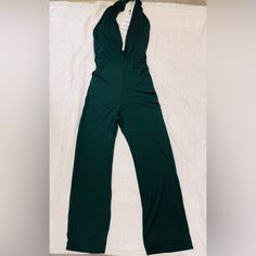 Dark Green Jumpsuit Dark Green Size Medium Open Neckline And Back. Brand New Green Stretch Halter Neck Jumpsuits And Rompers, Green Stretch Halter Neck Jumpsuit, Green Halter Neck Jumpsuit With Stretch, Fitted Green Halter Neck Jumpsuit, Green Stretch Bodysuit By Zara, Zara Green Stretch Bodysuit, Zara Sleeveless Jumpsuits For Date Night, Zara Green Fitted Bodysuit, Zara Strapless Sleeveless Jumpsuit For Party