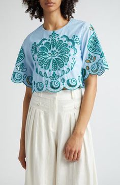 Embroidered eyelets brightly punctuate a lively cropped top designed with wide sleeves and embroidered scalloped edges. 17 1/2" length (size Medium) Back keyhole with button-and-loop closure Jewel neck Short sleeves Partially lined 100% cotton Hand wash, dry flat Imported FARM Rio will plant one tree for every purchase of its product as a partner of the global reforestation nonprofit One Tree Planted Hispanic & Latinx Owned/Founded Light Blue Top, Cotton Crop Top, Bright Spring, Scalloped Edges, One Tree, Farm Rio, Embroidery Dress, Wide Sleeves, Cropped Top