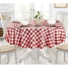 a red and white checkered tablecloth on a dining room table