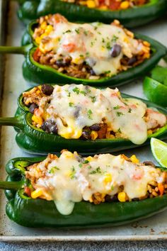 green peppers stuffed with mexican food and garnished with cheese