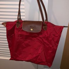 Brand New Never Worn Longchamp Red Tote Bag For Sale. $85 Classic Red Shoulder Bag With Leather Handles, Red Travel Shoulder Bag With Dust Bag, Red Shoulder Bag For Travel With Dust Bag, Classic Red Bags With Leather Handles, Red Bag With Snap Closure For Everyday Use, Red Longchamp Bag Outfit, Classic Red Large Capacity Bag, Long Champ Bag Outfit, Red Bags With Snap Closure For Shopping