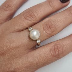 Engagement Gold ring, 14k Gold ring, Gold ring with pearl, ivory pearl gold ring, bridal pearl ring, bridesmaid gift This Shell handmade Gold ring with Pearl is made of 14K genuine gold and set with Natural Pearl. This Stunning Ring is set with Best AAA+ Quality Natural Pearl set in 14k Yellow Gold. High end finish with easy touch of diamond cut. This 14k Gold ring can serve as an engagement ring or a birthday gift. All colors at the picture are available. * Gemstone -8mm Round Natural Pearl. * Classic Yellow Gold Pearl Ring In Sterling Silver, Elegant Yellow Gold Pearl Ring With Sterling Silver, Elegant Round Halo Ring With Bezel Setting, 14k Yellow Gold Jewelry With Halo Setting, Timeless 14k Gold Pearl Ring, Timeless Round 14k Gold Pearl Ring, Elegant Pearl Ring With Bezel Setting For Formal Occasions, Elegant Pearl Ring With Bezel Setting For Formal Events, 14k Gold Heirloom Pearl Promise Ring