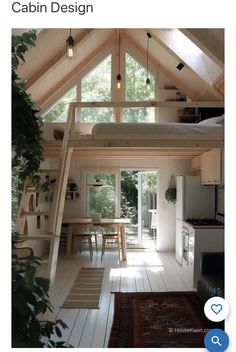 the interior of a small cabin with wood floors and vaulted ceilings, is shown in an instagram