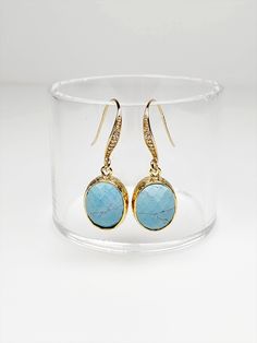 "Turquoise glass earrings, a timeless classic perfect for any occasion. Sparkling earrings feature oval faceted glass drops framed in 16k gold gracefully dangling from Gold-plated Cubic Zirconia ear wires. Dainty earrings measure 1 1/4 inches from top to bottom and the faceted glass drop is 1/2 inch wide. Silicone backs included. These dainty earrings make lovely bridal earrings, birthday gifts as well as a thoughtful sister gift, mom gift and a brilliant gift for you. Treat yourself! 🎁 Arrives Turquoise Earrings With Gemstone Accents For Formal Events, Formal Turquoise Earrings With Gemstone Accents, Elegant Turquoise Earrings With Gemstone Accents, Elegant Oval Pendant Earrings For Anniversary, Elegant Turquoise Gemstone Earrings, Classic Oval Hypoallergenic Earrings, Oval Earrings With Gemstone Accents For Formal Occasions, Oval Gemstone Accented Earrings For Formal Occasions, Classic Oval Earrings With Ear Wire