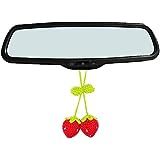 the rear view mirror has two cherries hanging from it