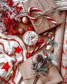 presents wrapped in brown paper and decorated with candy canes, pine cones, peppermints, christmas decorations