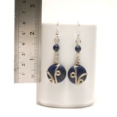 These handmade Wire Wrapped Lapiz Lazuli Earrings unique piece you are holding was made by hand especially for you... These Silver Earrings are simply stunning and perfect for livening up an everyday outfit. I can offer matching necklace and bracelet. My other pieces here: https://www.etsy.com/shop/BeyhanAkman My Lapis Earrings is coated with a durable clear non-toxic polymer to prevent tarnishing and oxidation formation. You'll receive this in a lovely gift wrapped box. I can include a handwrit Lapis Earrings, Gift Wrap Box, Lapis Lazuli Earrings, Earrings Wire, Silver Earrings Handmade, Handmade Wire Wrapped, Jewelry Christmas, Earrings Unique, Handmade Wire