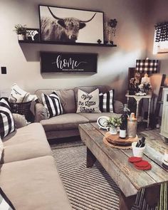 a living room filled with lots of furniture and decor on top of a wooden table