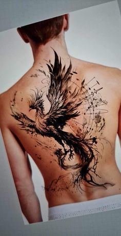 the back of a man's body with an artistic tattoo design on his chest