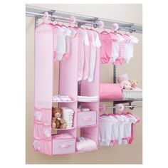 an organized closet for baby's clothes and toys