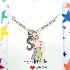 These rainbow shooting star charm necklaces and matching earrings make the perfect gift for birthday present, or a best friend, BFF, for girls.  These childrens jewellery can be personalised and you can add an initial to the necklace. Please choose the letter from the drop down menu.  These kids earrings and necklaces are made with enamel zinc alloy, zinc alloy letters and silver plated 16 inch chain.  The letters are 16x6mm small. You can message the seller if you want an 14 inch or 18 inch cha Handmade Dangle Charm Necklaces For Birthdays, Trendy Sterling Silver Charm Necklace As A Gift, Trendy Silver Charm Necklace For Personalized Gift, Trendy Personalized Charm Necklace For Mother's Day, Personalized Trendy Charm Necklaces For Gifts, Personalized Trendy Charm Necklaces As Gifts, Trendy Personalized Charm Necklace Gift, Trendy Custom Name Charm Necklaces For Gifts, Trendy Personalized Charm Necklace For Gifts