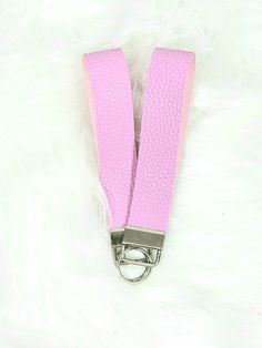 These are pink faux leather that measures approximately 5 inches in diameter Trendy Pink Wristlet With Keychain, Trendy Pink Wristlet With Wrist Strap, Trendy Pink Keychain For Everyday Use, Pink Wristlet For Everyday, Pink Wristlet With Wrist Strap For Everyday, Everyday Pink Wristlet With Wrist Strap, Pink Wristlet With Lobster Clasp For Gifts, Trendy Pink Wristlet For Everyday, Adjustable Pink Wristlet With Wrist Strap