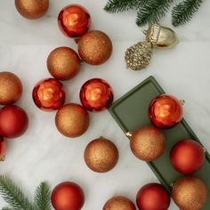 red and gold ornaments on a white table