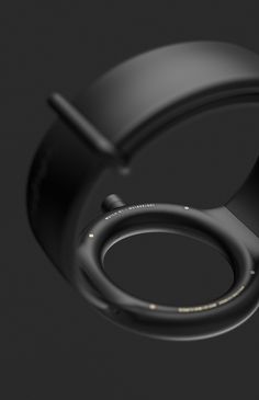 a black ring is shown on a dark background