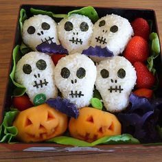 a box filled with rice covered in halloween treats