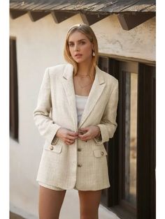 Stay on trend with our To Those Who Hustle Tweed Blazer in Cream. This relaxed fit blazer features a wide lapel and notched collar, along with single breasted button down and decorative button flap pockets. With antique gold crest buttons and a fully lined design, this blazer offers a timeless look with modern convenience. Color: Cream Fabric: 100% Polyester (Self and Lining) Brand: Endless Blu Sizes: S-M-L, Regular Sizing. Cream Fabric, Fitted Blazer, Tweed Blazer, Notched Collar, Flap Pocket, Single Breasted, Antique Gold, Relaxed Fit, Blazer