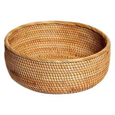 a round woven basket on a white background