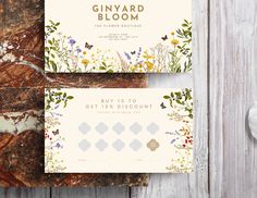 the ginyard bloom gift card is shown on top of a piece of paper with flowers and leaves