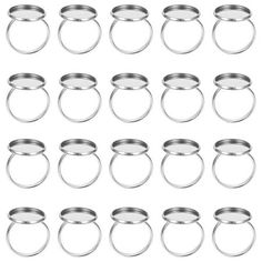 a set of twelve metal rings on a white background