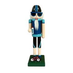 a wooden toy with sunglasses on it's head and a blue body, standing in front of a white background