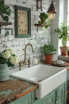 a white sink sitting next to a green cabinet