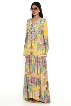 Yellow enchanted print embroidered yoke art georgette boho dress. Disclaimer: Since we are a made-to-measure brand and our dyeing process and embroidery are handcrafted, there may be slight variations in the color and embroidery of the actual product. The print placement may also vary from what is represented in the images shown on the product page. Yellow Tunic Dress With Floral Embroidery, Traditional Flowy Boho Dress For Spring, Flowy Boho Dress For Spring, Spring Tunic Dress With Yoke Detail, Multicolor Yoke Dress For Summer, Multicolor Summer Dress With Yoke Detail, Yellow Bohemian Maxi Dress With Floral Embroidery, Silk Dress With Embroidered Neckline For Spring, Bohemian Dress With Embroidered Neckline For Spring