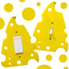 two yellow switch plates with white dots on them