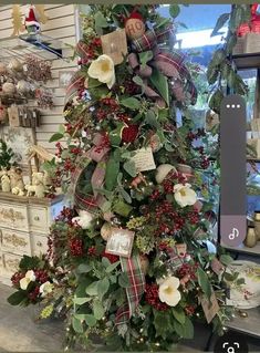 a decorated christmas tree in a store