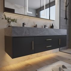 a bathroom with two sinks, mirrors and lights on the wall next to each other