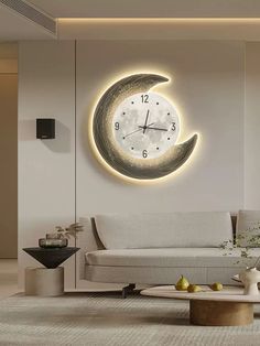 a living room with a large clock on the wall next to a couch and coffee table