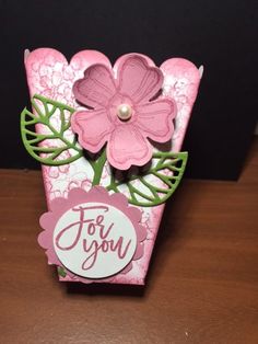 a card with pink flowers and green leaves on the front, saying for you in white lettering