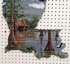 a piece of wood that has been cut out to look like the state of mississippi