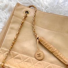 Authentic Beige/Tan Chanel Cc Lambskin Tote Purse My Mom Originally Paid 2,500 For This Purse A Few Years Back. Condition: The Bag Is In Fair Condition. There Are No Major Flaws, All Hardware Is Working. It Also Still Has The Keychain Attached Which Is Worth 200 On Its Own. The Bad Does Have Some Scratches And Marks On The Outside And Interior, But Some Leather Polish/ A Visit To A Leather Clinic Would Fix Those Small Marks. This Bag Is Originally 2,500 Dollars And Is In Good Condition, Please No Super Low Balls. Lowest I Will Accept Is ~500 Dollars 500 Dollars, Tote Purse, The Bad, My Mom, Chanel Bag, Chanel, Bag Lady, Purse, Shoulder Bag