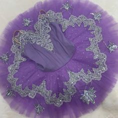 a purple tutu with silver sequins on it