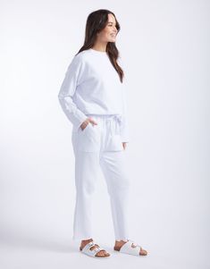 DESCRIPTION Stay effortlessly chic with the Raw Edge Lounge Pants in White by White & Co. The Label. These stylish lounge pants boast a relaxed fit with a straight leg and raw hem, adding a contemporary edge to your casual wardrobe. The elastic waistband with a drawstring tie provides a secure and comfortable fit, while the large front patch pockets enhance both functionality and style. Perfect for lounging around the house or casual days out, these pants are a versatile addition to any wardrobe. For a classic and timeless look, pair these white lounge pants with a crisp white tee and white sneakers. Dress them up with a colourful blouse and strappy sandals for a more polished look. These pants are perfect for creating both relaxed and elevated outfits. Still browsing? Discover our full ra Relaxed Fit Bottoms With Straight Hem For Lounging, Relaxed Fit Loungewear Bottoms With Straight Hem, Relaxed Fit Bottoms For Loungewear With Straight Hem, Relaxed Fit Bottoms With Straight Hem For Loungewear, Relaxed Loungewear Pants With Straight Hem, Straight Hem Pants With Pockets For Loungewear, Loungewear Pants With Pockets And Straight Hem, Lounging Pants With Pockets, Pants With Pockets For Lounging