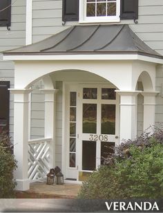 a house with white trim and black shutters